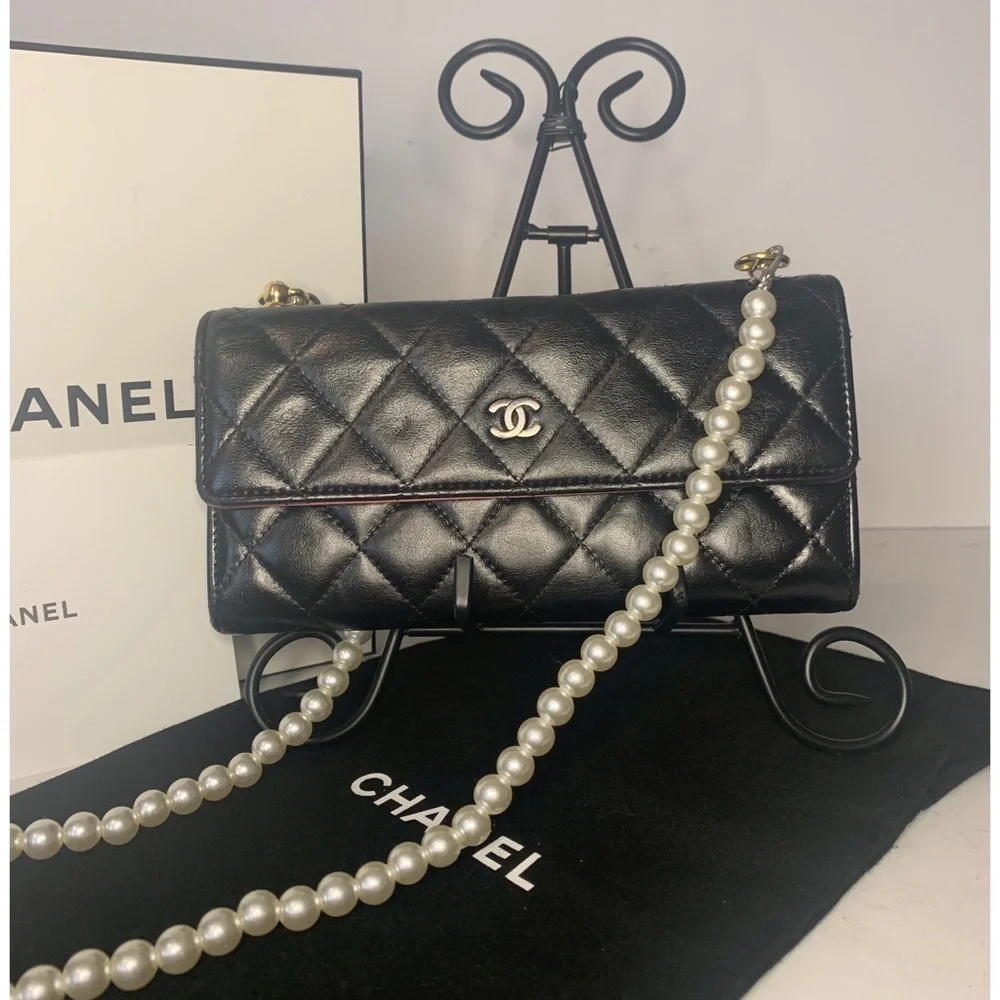 CHANEL Black Quilted Lambskin Crossbody with Gold Chain & Tassel Accent